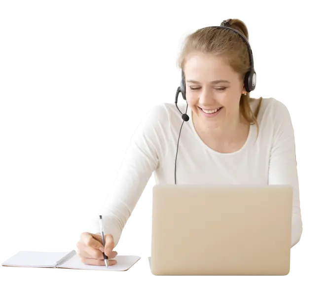 A woman smiling while using a PC